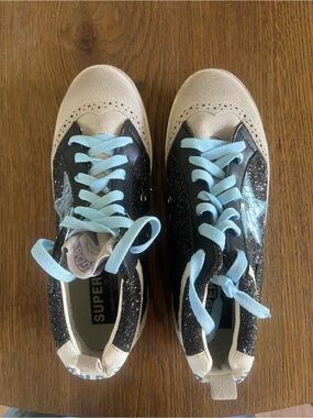 Golden Goose Super-Star Sneakers in Black Glitter with Light Blue Laces